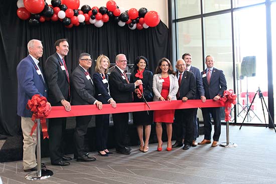 Katy Mayor Bill Hastings, Congressman Pete Olson, Associate Vice President Jay Neal UH at Katy, UH System Vice Chancellor Paula M. Short, UHV President Robert Glenn, UH System Chancellor Renu Khator, Representative Gina Calanni, UH System Regent Durga Agrawal, UH System Student Regent John Fields, UH System Vice Chancellor Jason Smith cutting a red ribbon