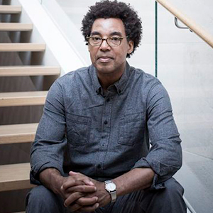 Photograph of Rick Lowe sitting on stairs