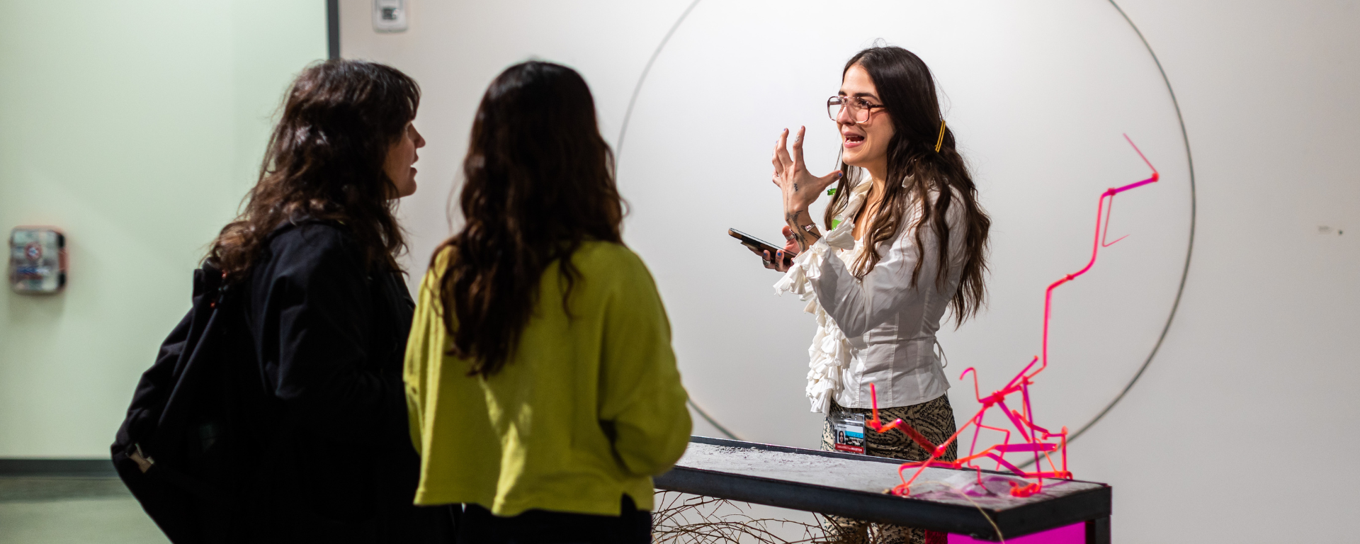 an artist speaks about her work at an Elgin Street Studio show