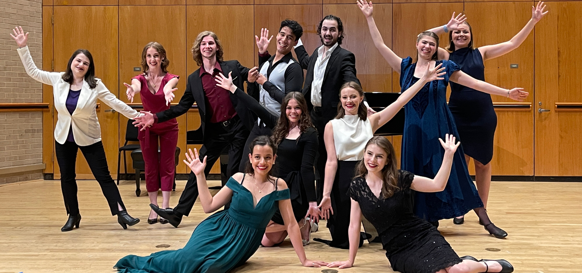 Vocal Institute students smiling and posing with jazz hands