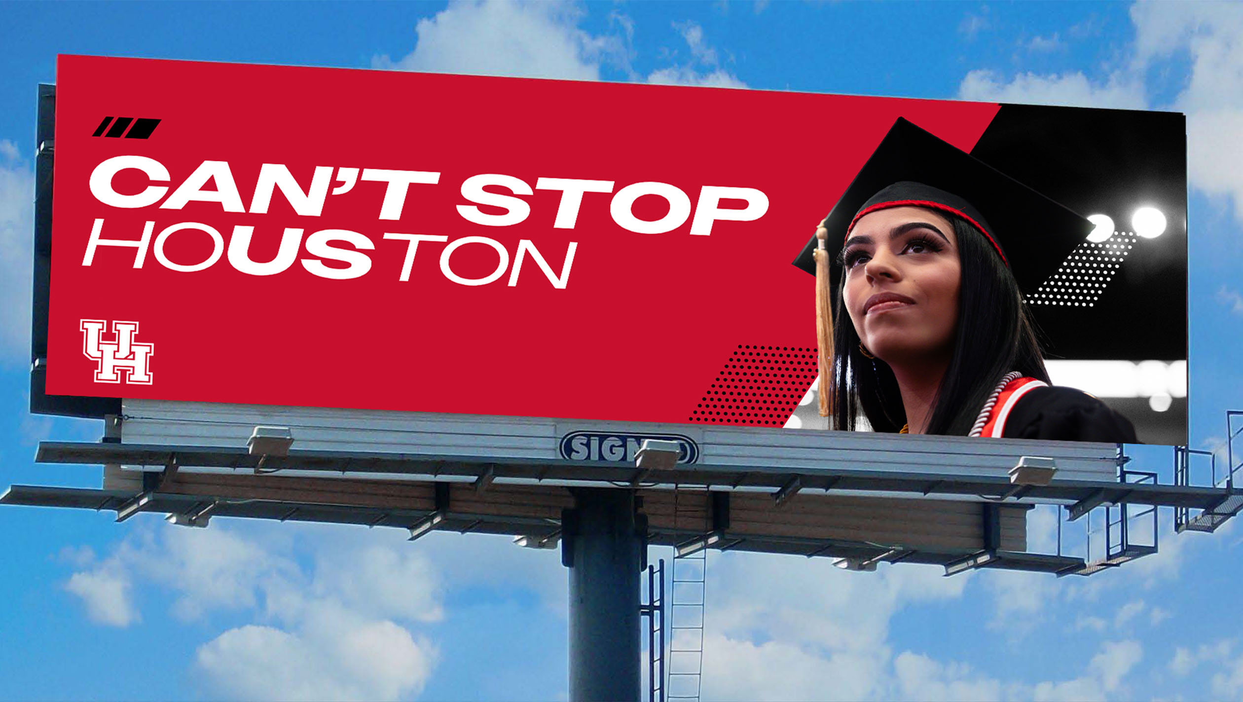 Billboard with a photo of a UH graduate in a powerful pose with text that says, “Can’t Stop Houston.”