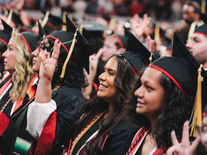College of Liberal Arts and Social Sciences students smiling at may 2025 graduation